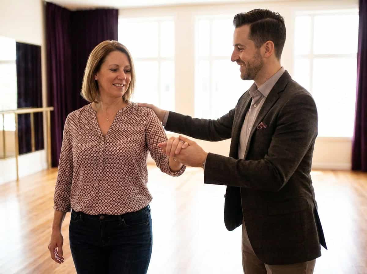 At your first ballroom dance lesson you're guided, not judged — instructor showing a beginner a simple frame