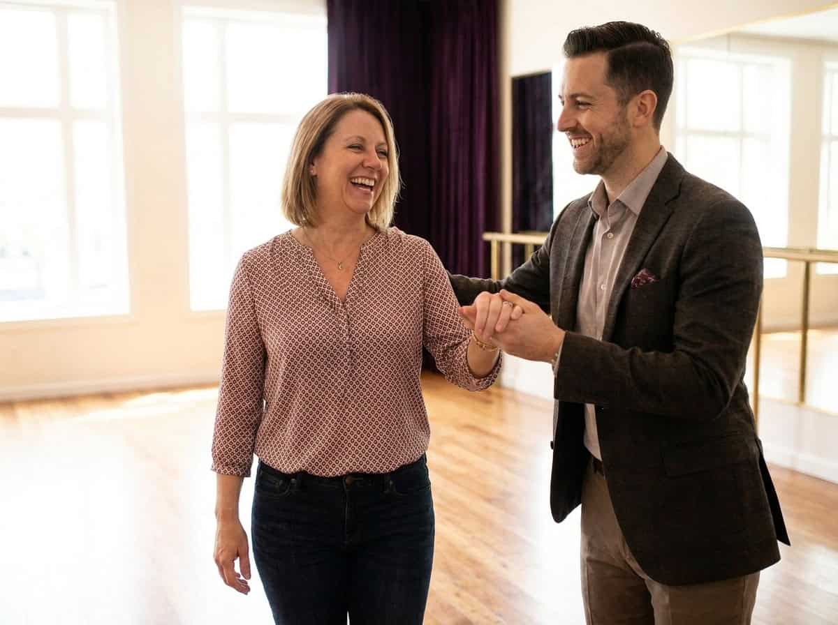 A beginner laughing and relaxed at a first dance lesson — present, supported, and enjoying learning